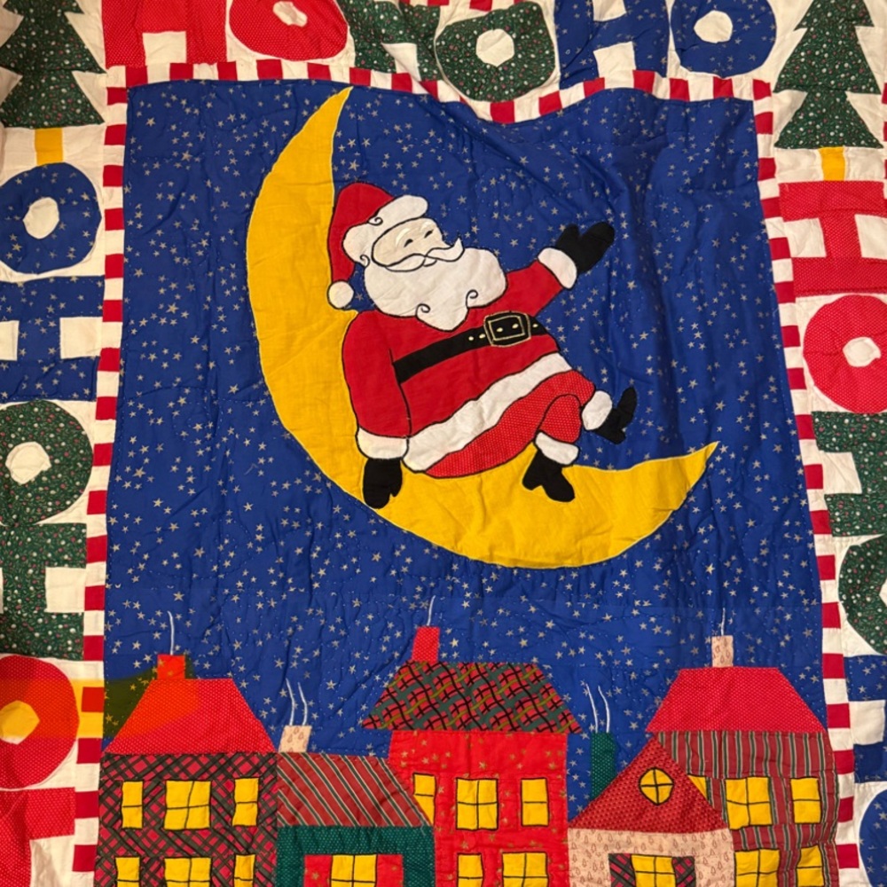 Festive Santa Quilt with Colorful Holiday Design